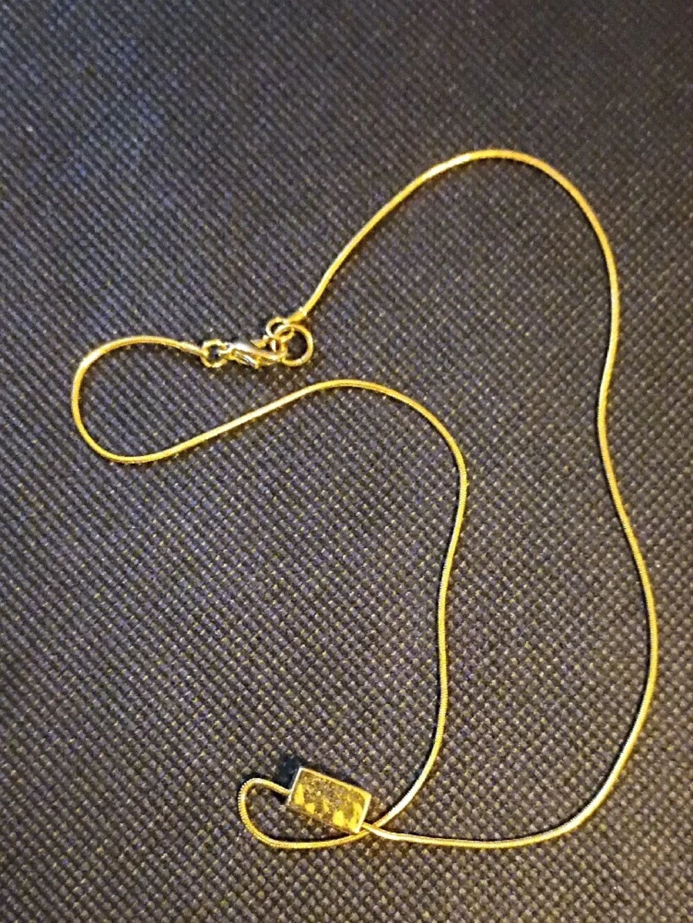 Tommy Hilfiger gold tone